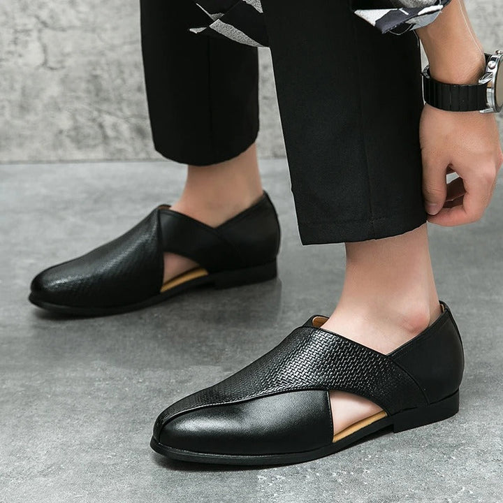 Side profile of a men's Italian woven leather loafer, emphasizing the sleek silhouette