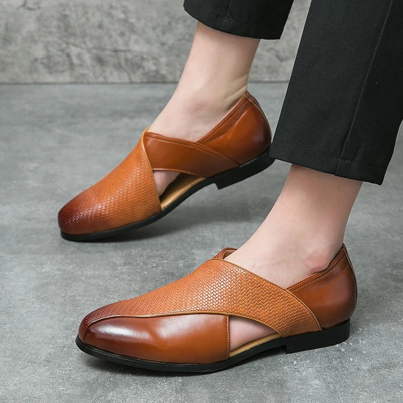 Pair of men's woven leather loafers in a rich tan color, versatile for business casual outfits