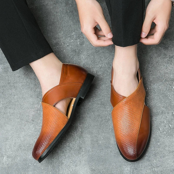 Detailed view of the woven pattern on men's leather loafers, highlighting quality and style