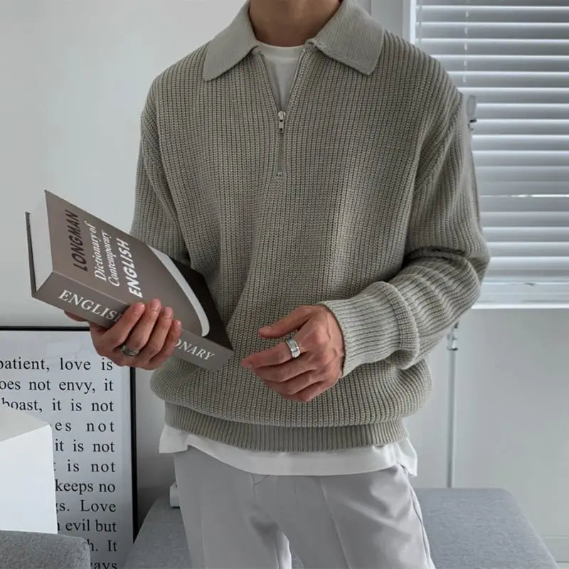 Sophisticated men's fall fashion sweater, quarter zip and jacquard knit, offering warmth and style.