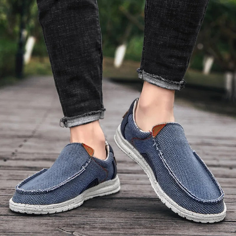 Front view of men's blue canvas slip-on shoes, perfect for everyday wear