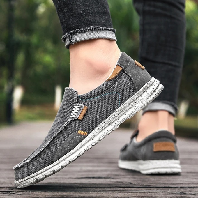 Close-up of stitching on men's khaki canvas slip-on comfort shoe design