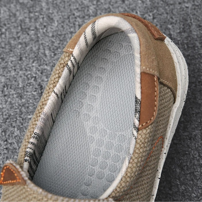 Man wearing blue canvas slip-on shoes, showcasing casual men's fashion