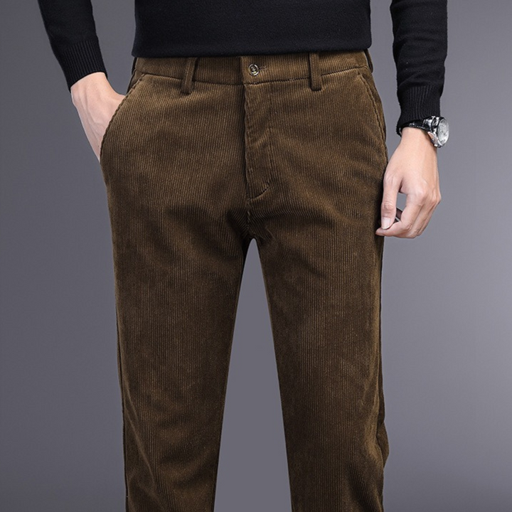 Collection of men's corduroy stretch comfort trousers in khaki, navy, black, and brown.