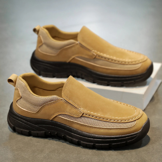 Stylish black slip-on comfort shoes for men, featuring breathable mesh and soft suede