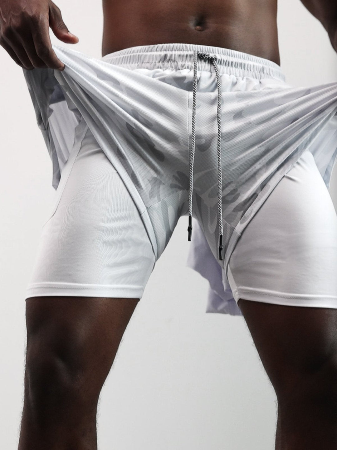 Close-up of the waistband on Men's Kinetic Mesh Lined Athletic Shorts, with drawstring