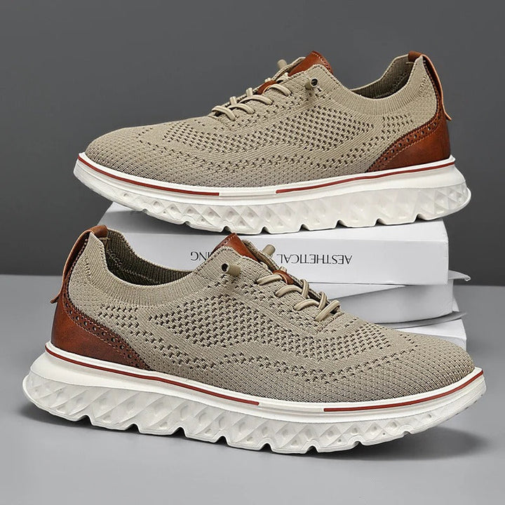 Close-up of men's knit sneakers featuring classic brogue detailing, combining style and comfort.