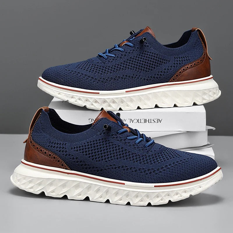 Stylish men's knit dress sneakers with brogue perforations, blending elegance and athletic comfort.