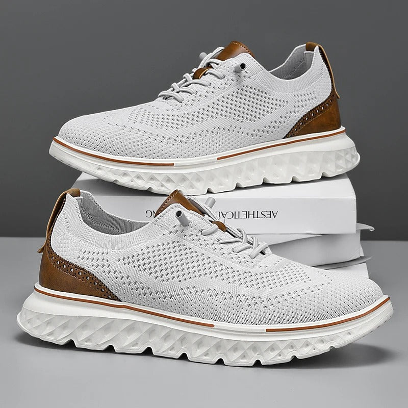 Side view of men's knit dress sneakers showcasing brogue patterns and a comfortable sole.