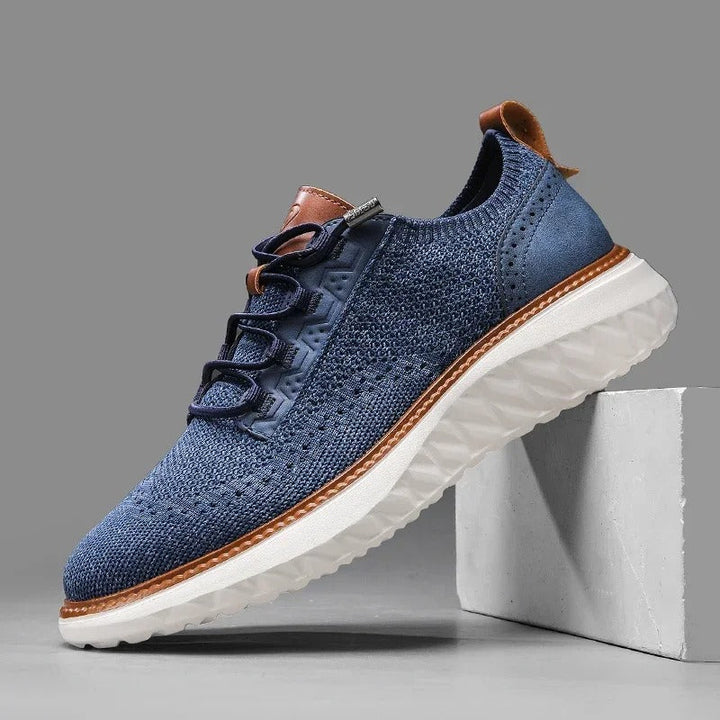 Comfortable men's knit casual shoe in khaki with subtle blue leather accents, highlighting lightweight design.