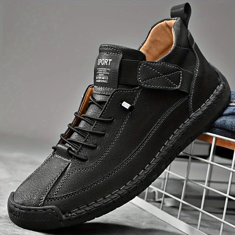 Underside of men's black orthopedic leather sneakers, showing the textured sole for enhanced grip.
