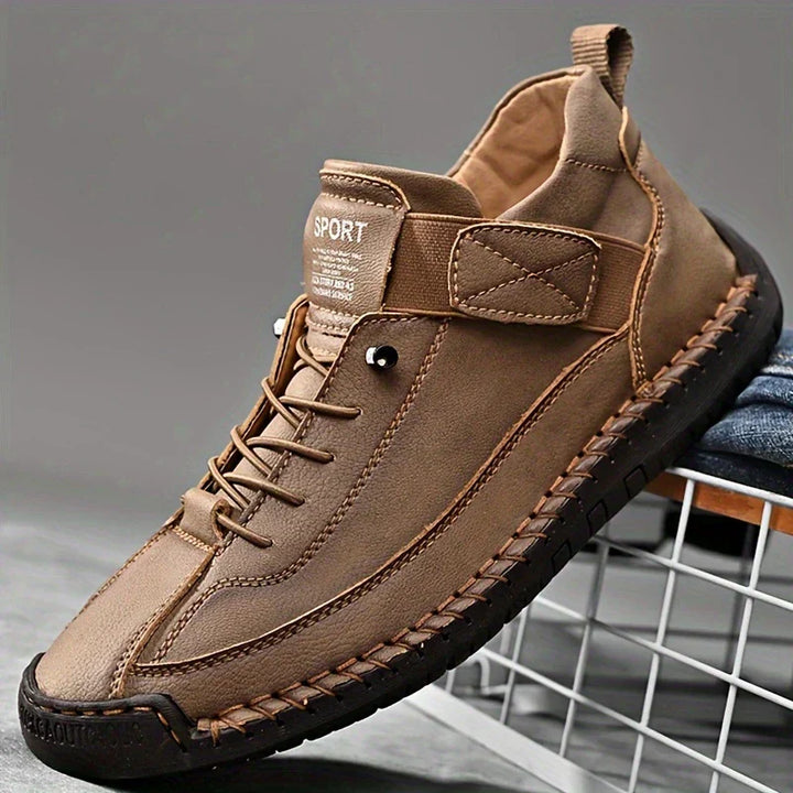 Close-up of the elastic slip-on feature on men's black leather orthopedic casual sneakers.