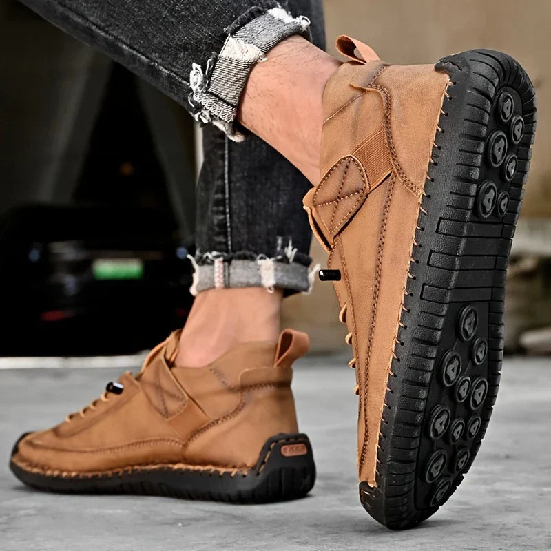 Front view of black mens orthopedic leather sneakers, showcasing the clean, minimalist design.