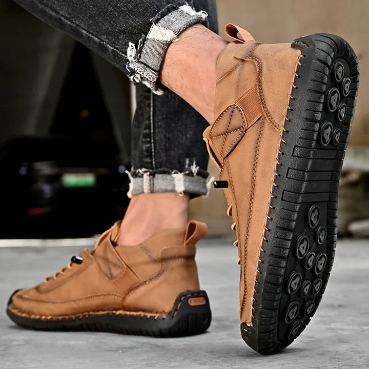 Front view of black mens orthopedic leather sneakers, showcasing the clean, minimalist design.