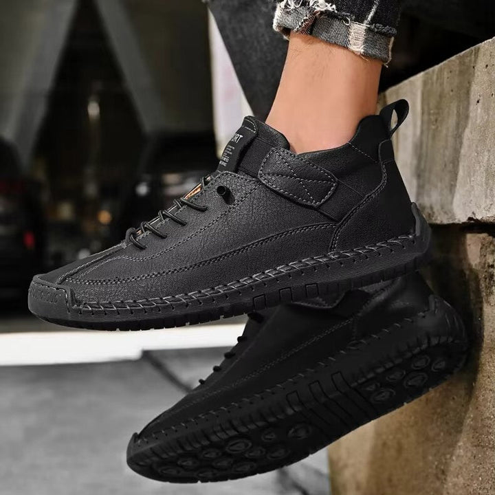 Pair of supportive men's black leather orthopedic sneakers, an essential for comfort-seeking individuals.