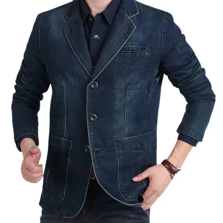 Modern men's dark denim blazer, a versatile piece transitioning from casual to formal fashion effortlessly.