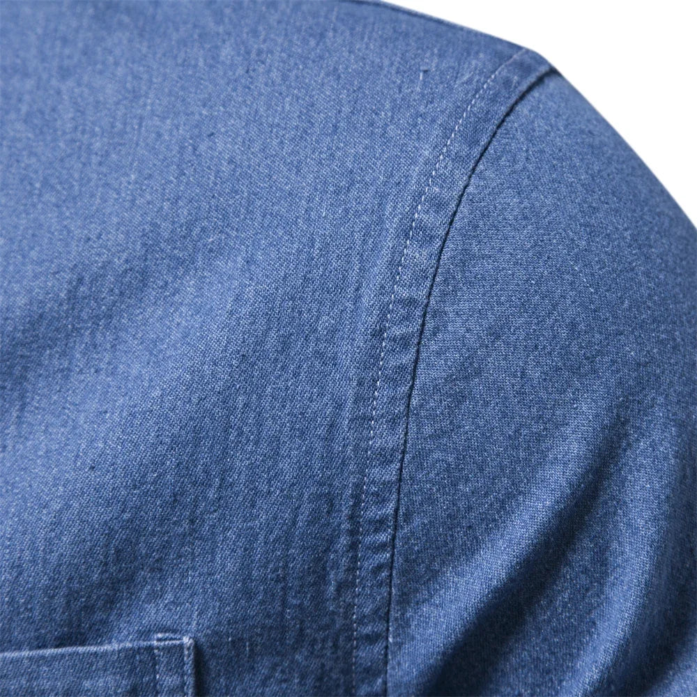 Men's light blue denim button-up shirt, classic design for casual style.