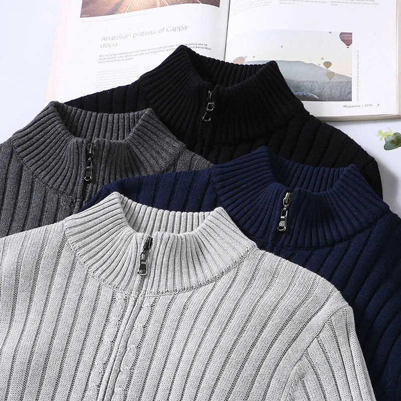 Flat lay of men's ribbed knit zip sweater in light gray, detailing the zipper and fabric