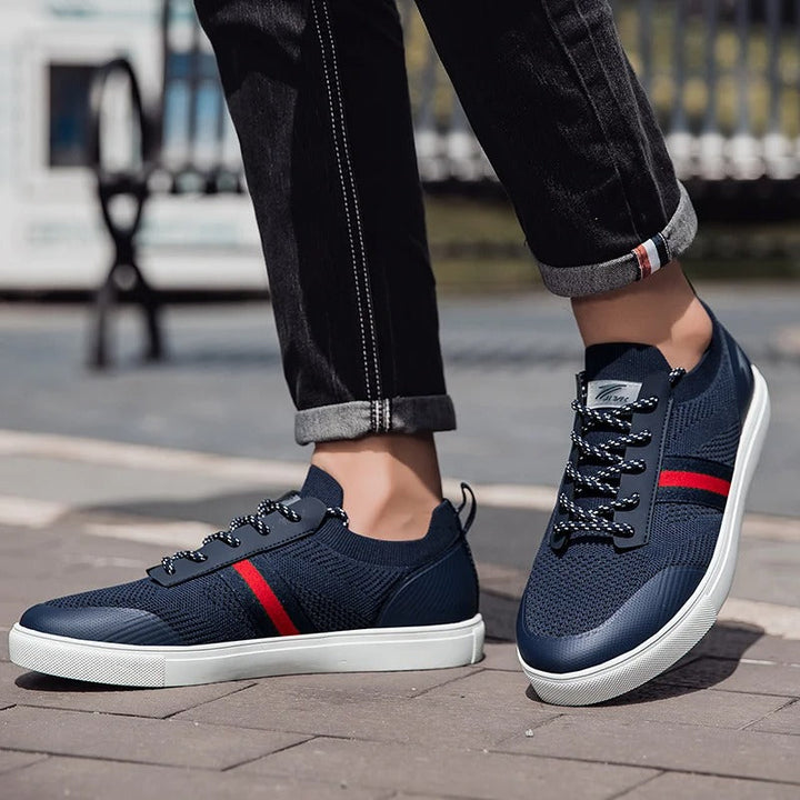 Pair of men's slip-on knit sneakers in navy and gray, ideal lightweight athletic footwear