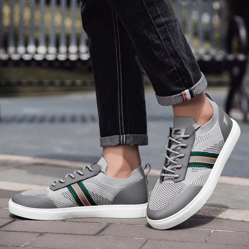 Men's gray knit athletic footwear, showcasing slip-on feature & comfort for active lifestyles