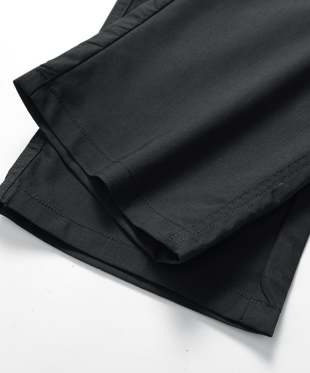 Side view of men's lightweight outdoor pants, showcasing their relaxed athletic fit.