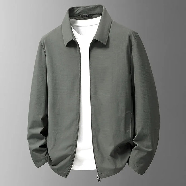 Close-up of a men's waterproof jacket fabric, highlighting its performance and durable construction.