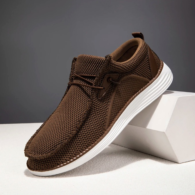 Close-up of the woven mesh texture on men's lightweight slip-on loafers, breathable design
