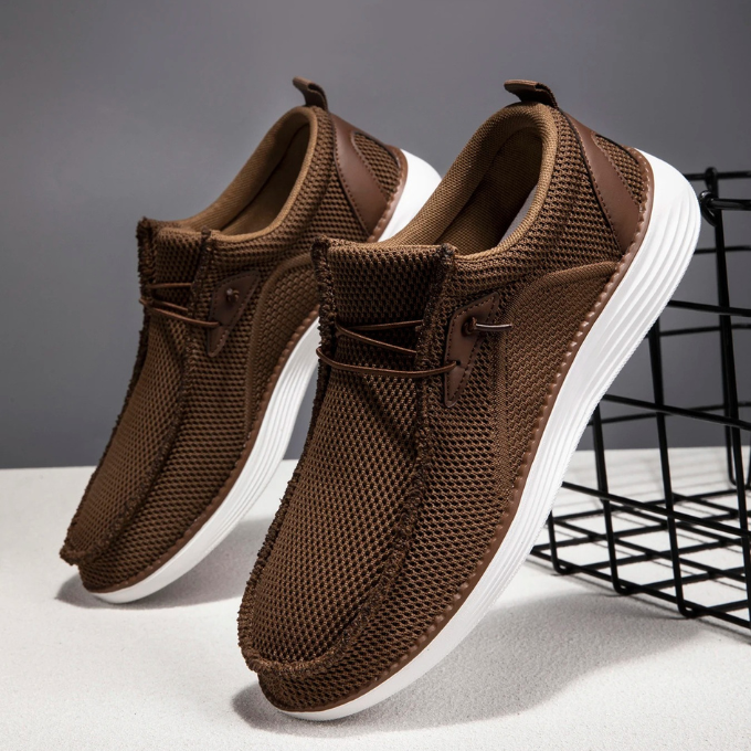 Pair of men's casual slip-on loafers from a top-down view, showcasing woven material