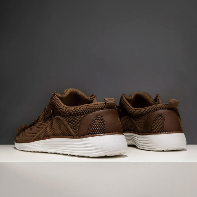 Men's slip-on loafers with a flexible sole, emphasizing their comfortable and lightweight build