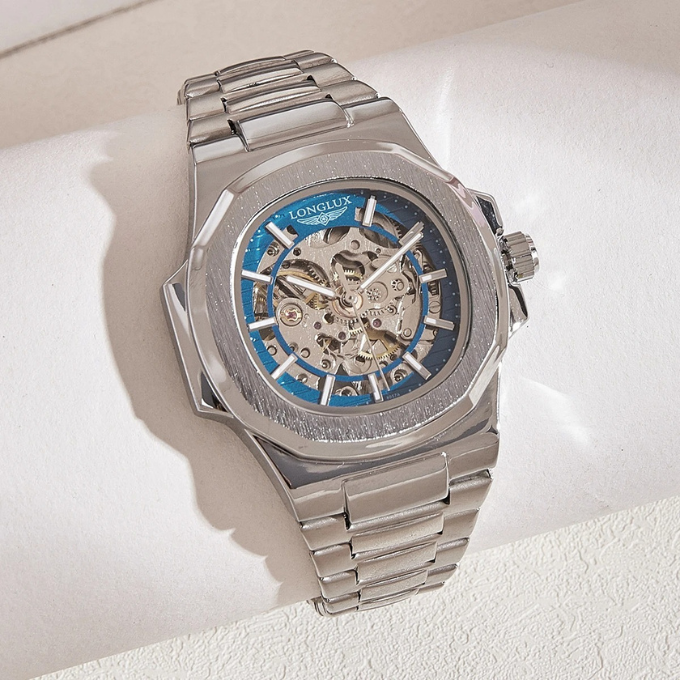 Close-up of men's automatic skeleton watch, showcasing intricate mechanical movement and gears
