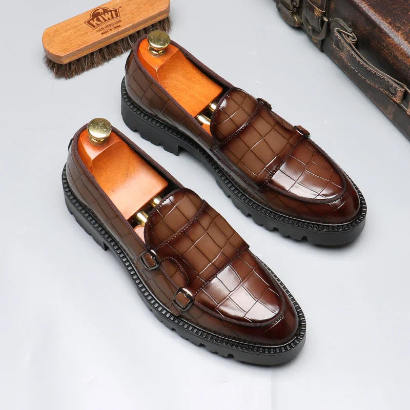 Men's luxury black crocodile embossed leather loafers with a sleek profile, perfect for formal occasions.