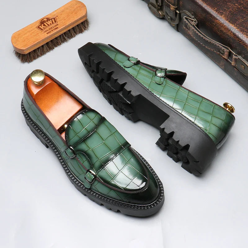 Pair of men's dress shoes: black crocodile embossed slip-on loafers, highlighting their upscale and formal design.