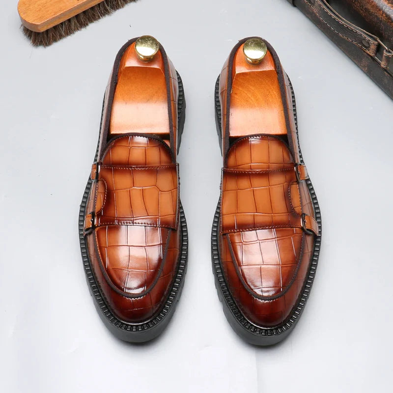 Side view of a men's black crocodile embossed loafer, emphasizing the elegant shape and high-quality craftsmanship.