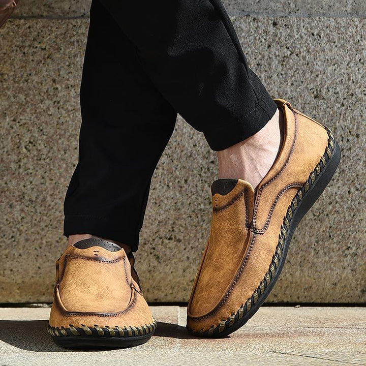 Sophisticated men's footwear: black leather business casual shoes with round toe design