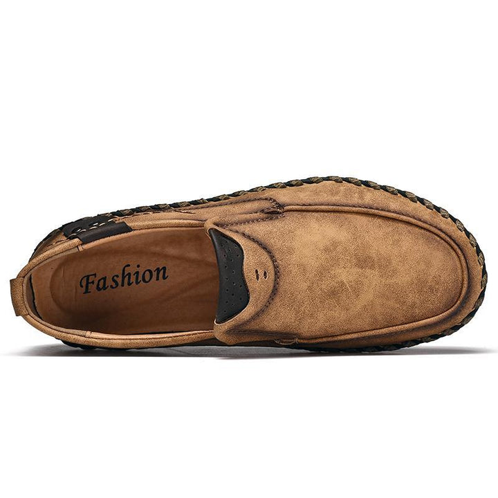 Close-up of men's black leather business casual shoe, showcasing fine leather texture