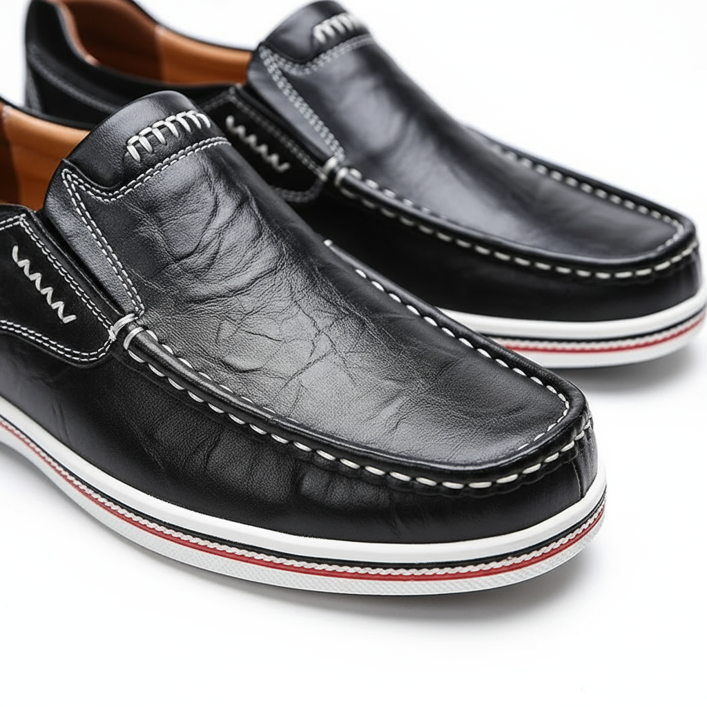 Men's fashion: pair of dark brown leather loafers on a clean background, smart and casual.