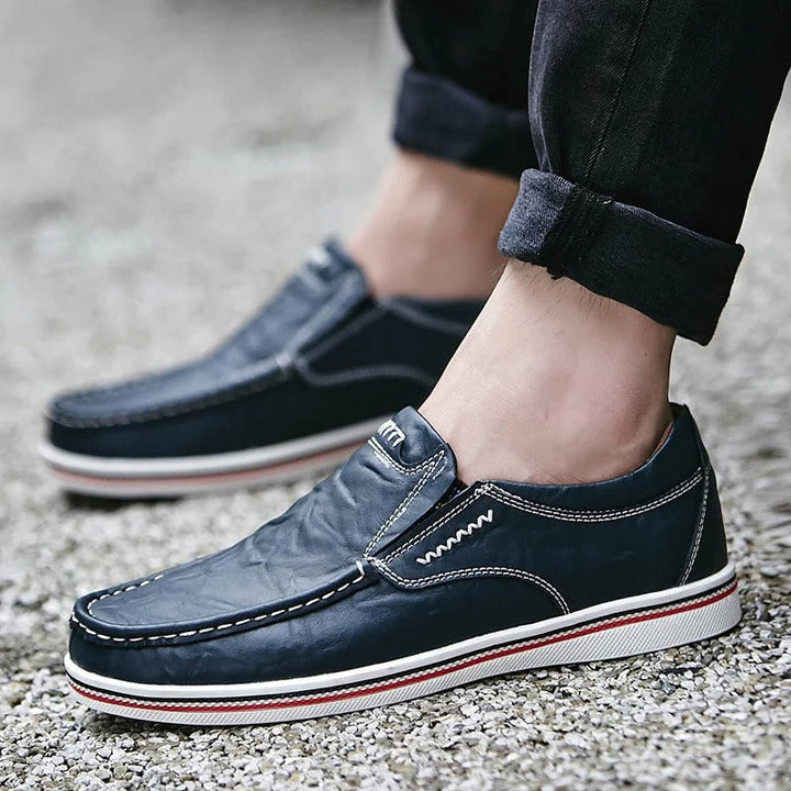 High-angle view of men's leather loafers, capturing their refined silhouette and luxury appeal.