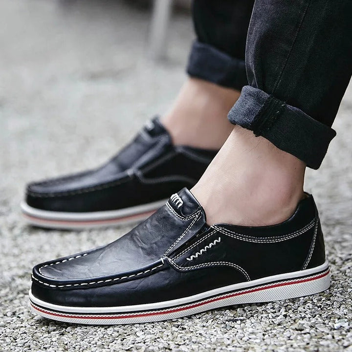 Close-up of a men's leather loafer, highlighting the fine texture and quality craftsmanship.