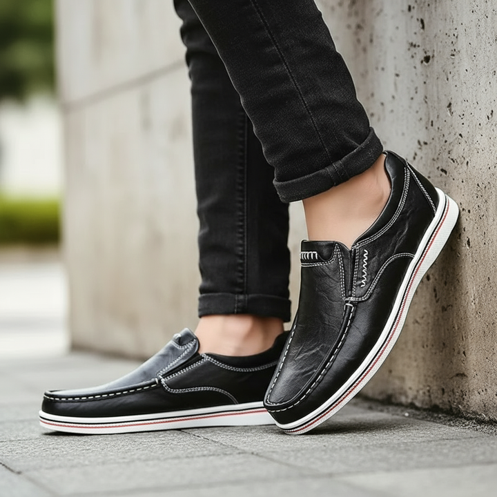 Side view of a men's casual leather loafer, emphasizing its slip-on design and comfort.