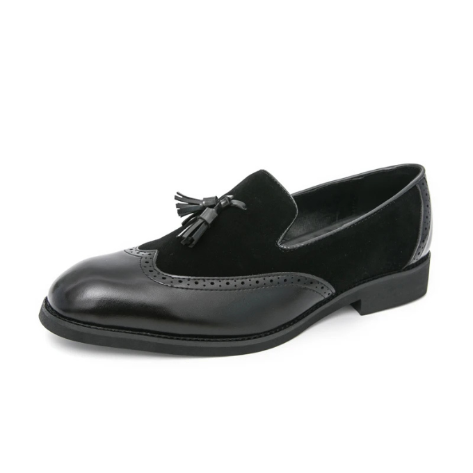 Men's dapper black loafers with tassel, styled for a gentleman's wardrobe, versatile dress shoes.