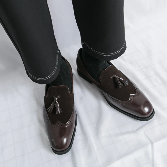Bottom view of men's black leather loafers, highlighting the durable sole for lasting comfort.