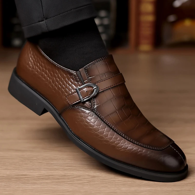Men's dress shoes: luxurious crocodile-textured monk strap loafers, a staple for refined men's fashion.