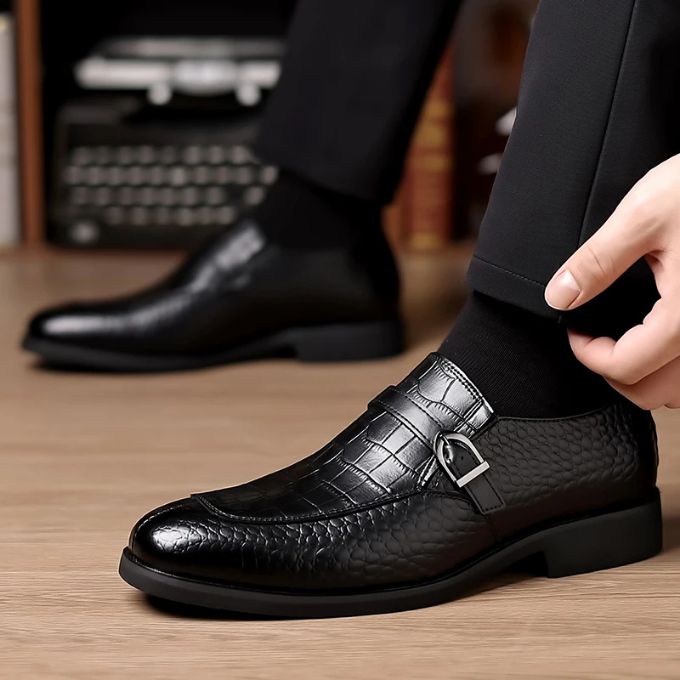 Side view of a men's elegant black monk strap loafer, perfect for office or special occasions, luxurious finish.