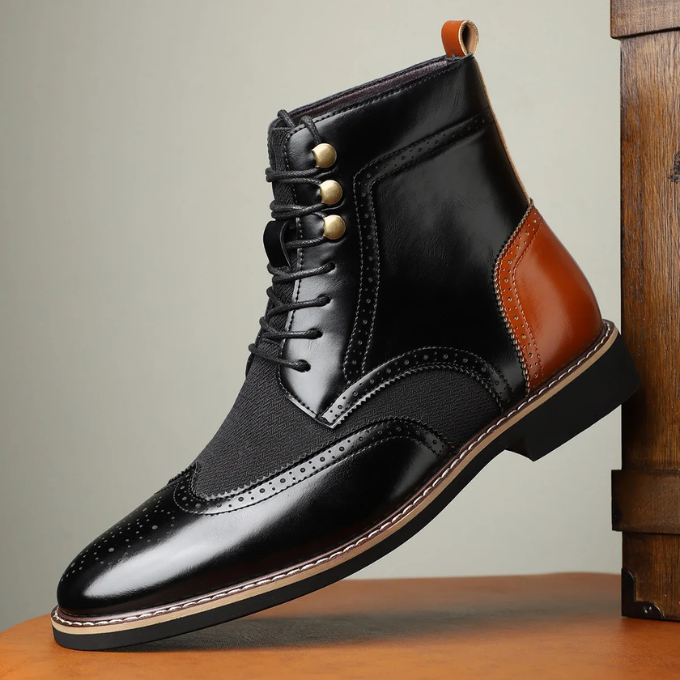 Close-up of the intricate brogue patterning on a stylish men's leather dress boot, perfect for formal wear.