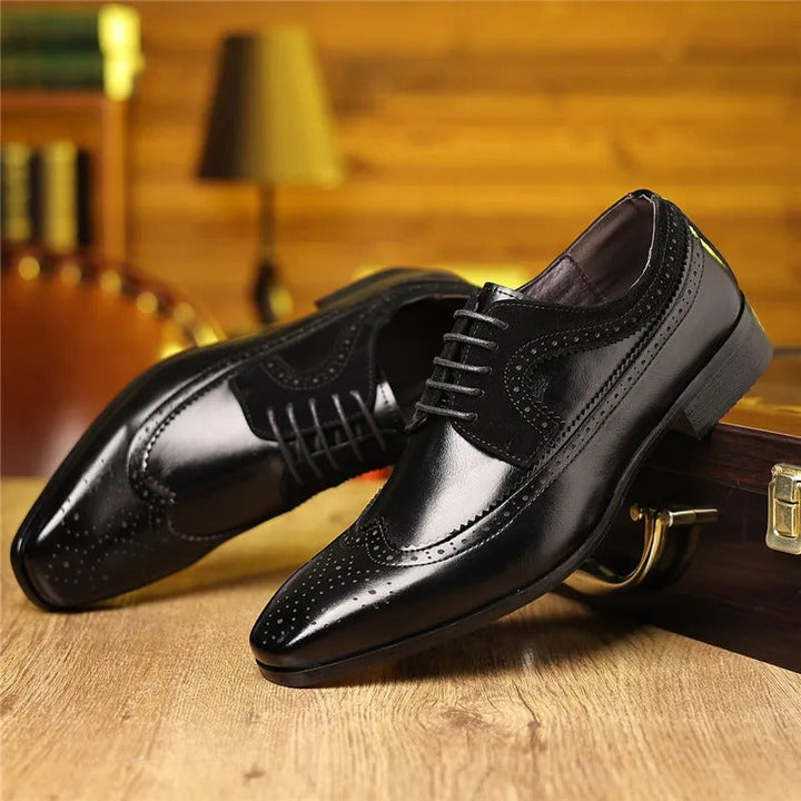 Detailed shot of the high-quality craftsmanship on men's leather brogue Oxford dress shoes.