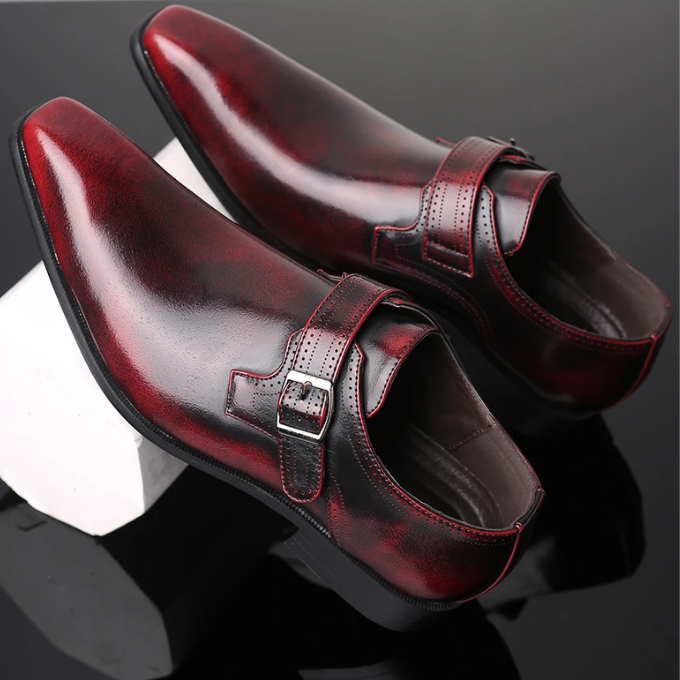 Close-up of men's burnished leather monk strap shoes with buckle detail, classic