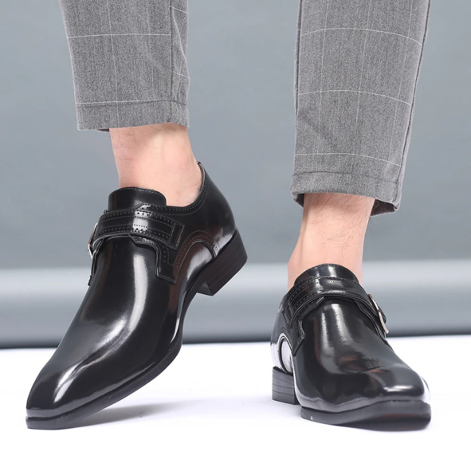 Men's burnished leather monk strap shoes in a professional setting, formal footwear