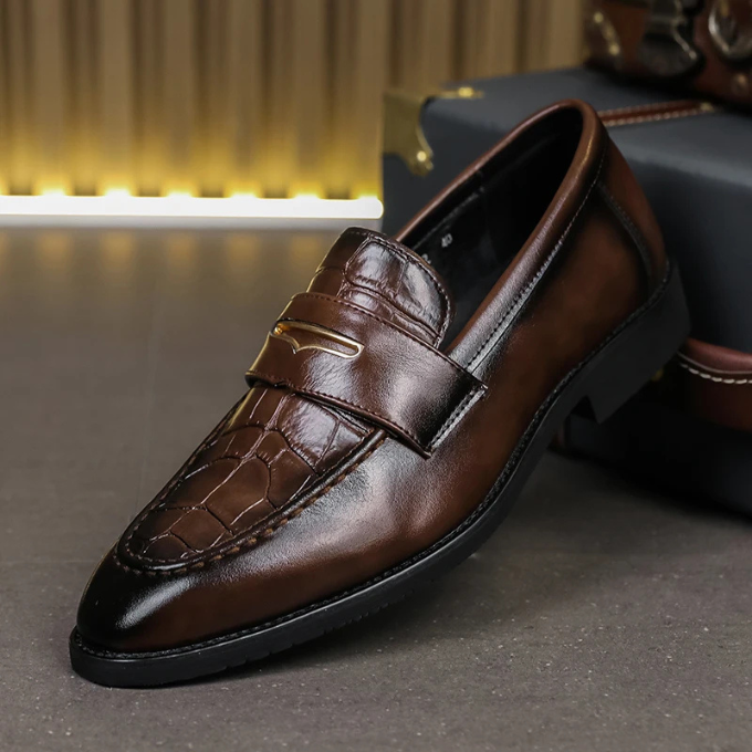 Close-up of men's croc-embossed leather loafers, showcasing texture and classic style
