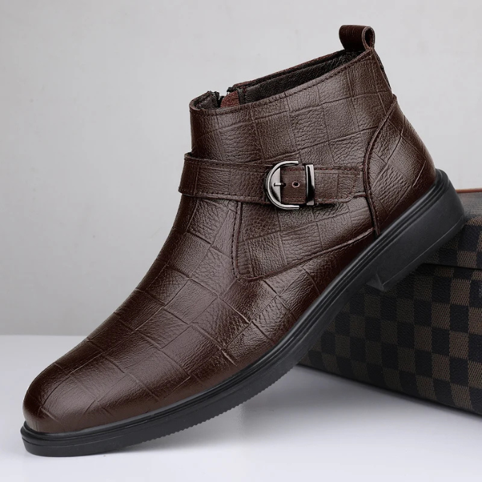 Classic black full-grain leather men's ankle boots, a durable and stylish footwear choice.
