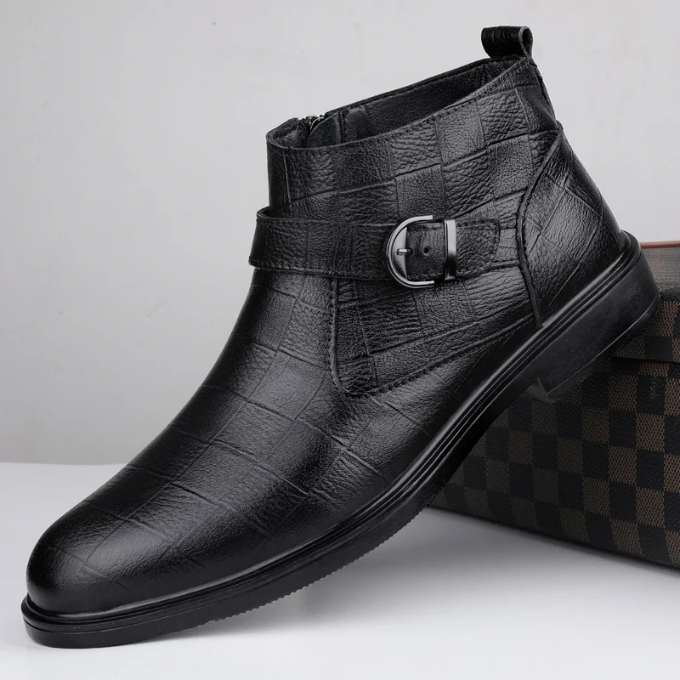 Pair of men's full-grain leather ankle boots, one brown and one black, for versatile styling.